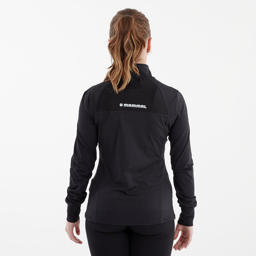 Back view of a woman wearing a black recycled fitness jacket