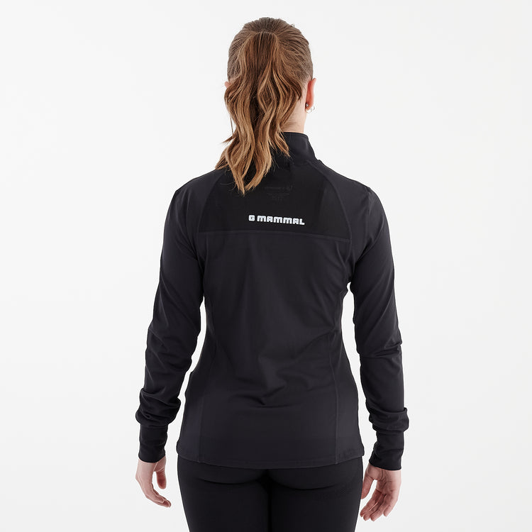 Back view of a woman wearing a black recycled fitness jacket