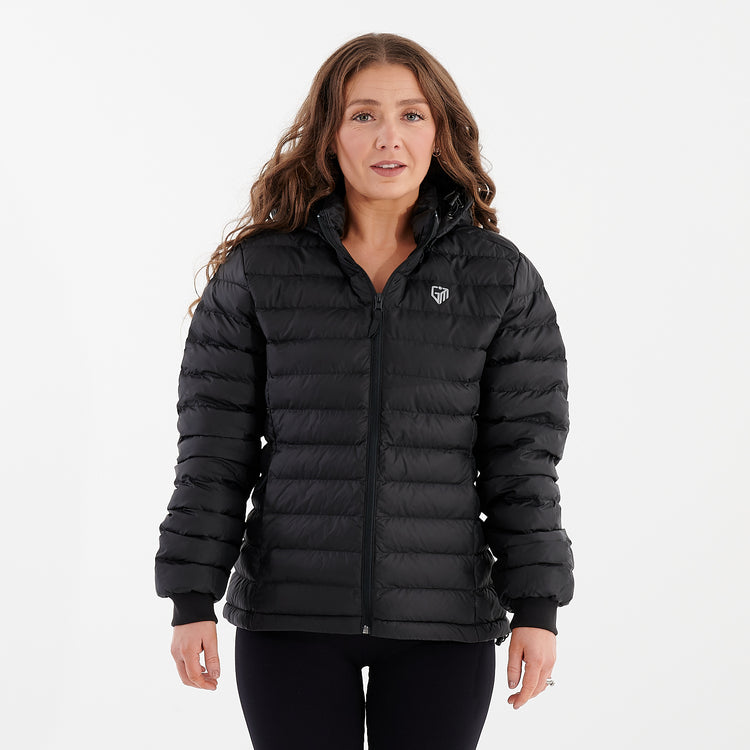 Front view of a woman wearing a black recycled lightweight jacket