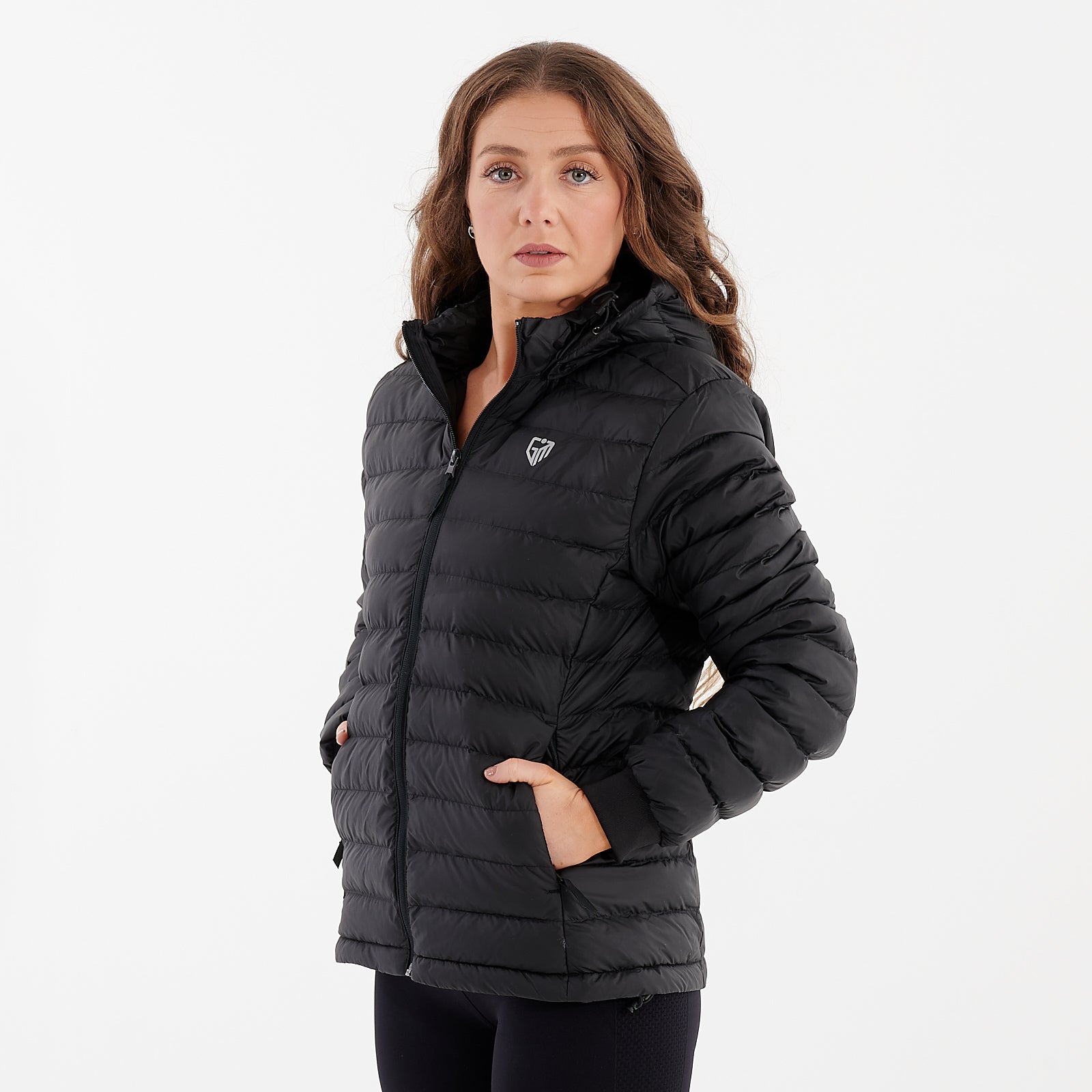 Side view of a woman wearing a black recycled lightweight jacket
