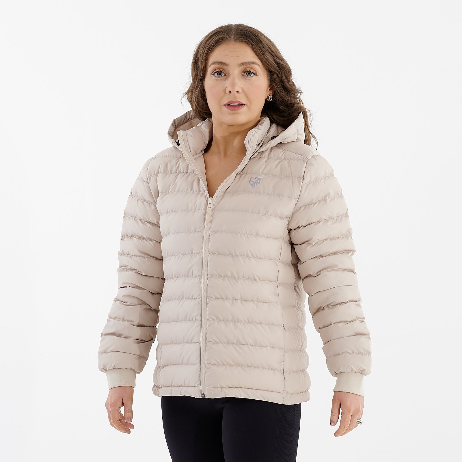 Side view of a woman wearing a desert dust recycled lightweight jacket
