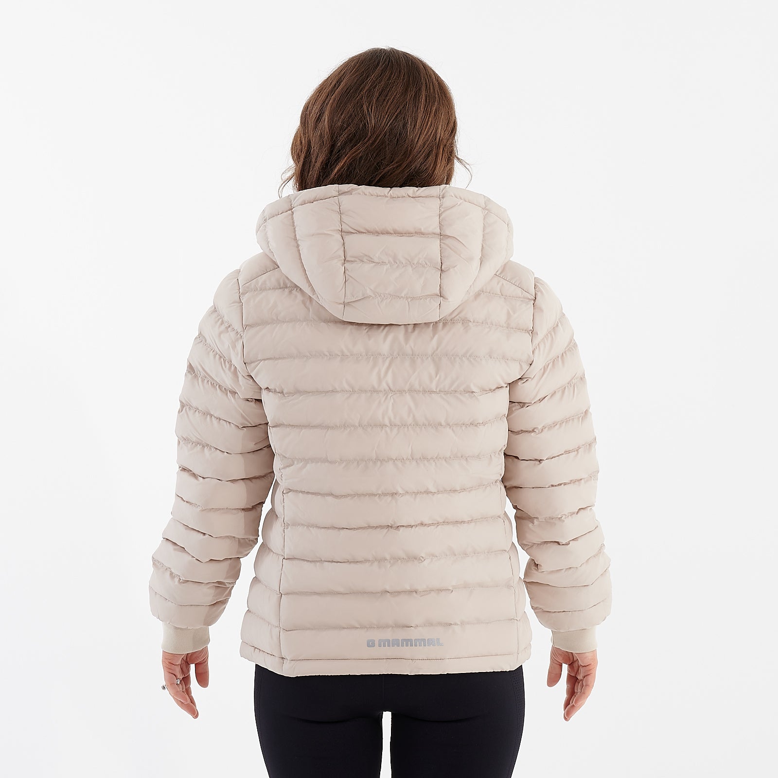 Back view of a woman wearing a desert dust recycled lightweight jacket
