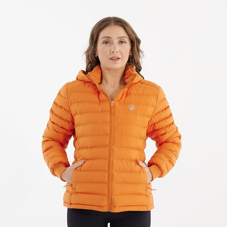 Front view of a woman wearing a flame orange recycled lightweight jacket