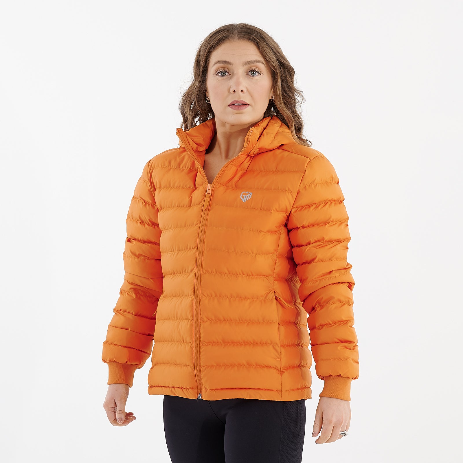 Side view of a woman wearing a flame orange recycled lightweight jacket