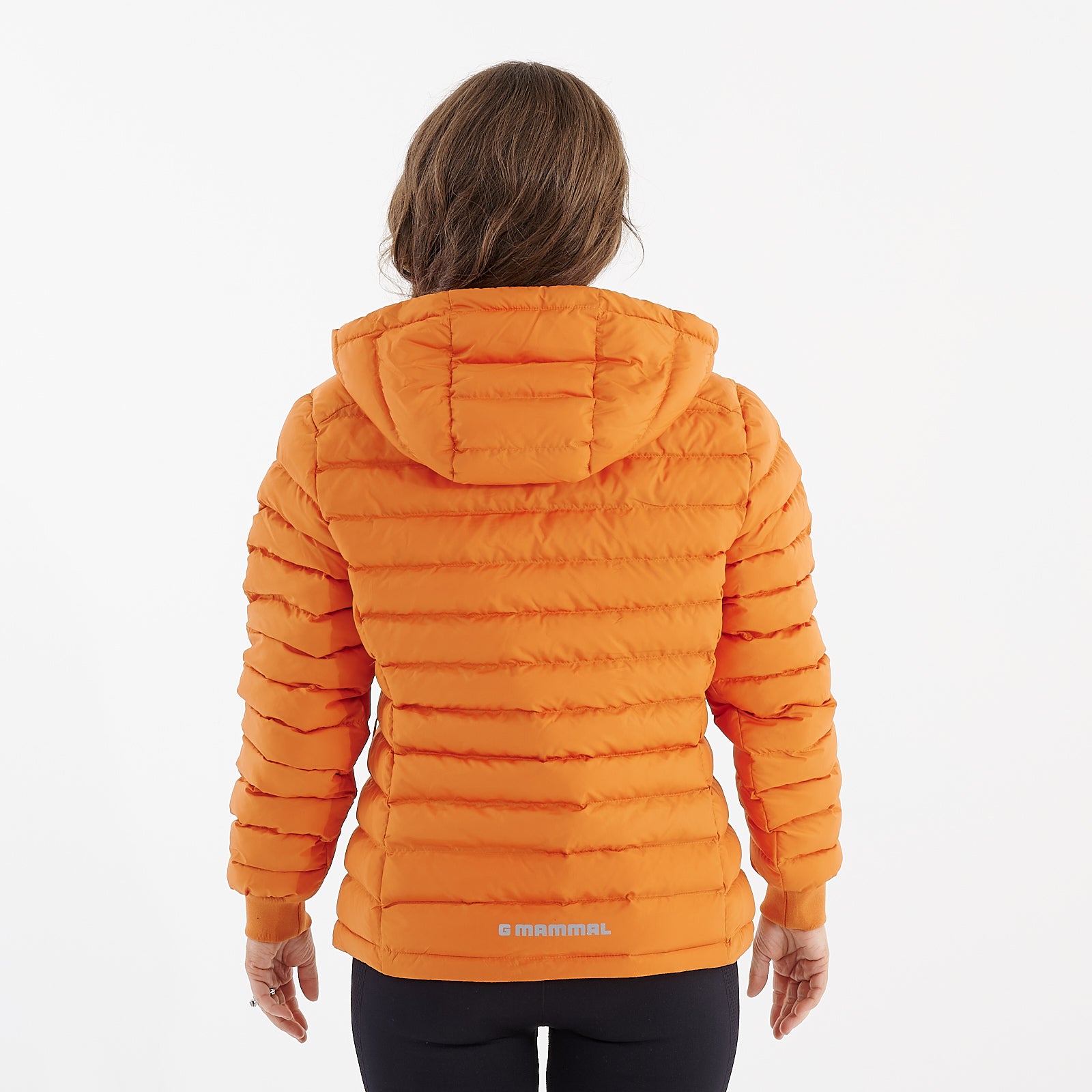 Back view of a woman wearing a flame orange recycled lightweight jacket